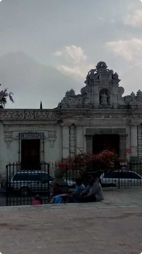 Old and older: Stucco facade and the Volcán de Agua